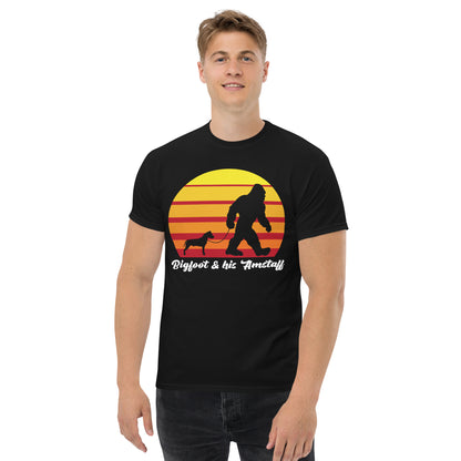 Big foot and his Amstaff men’s black t-shirt by Dog Artistry. American Staffordshire t-shirt.