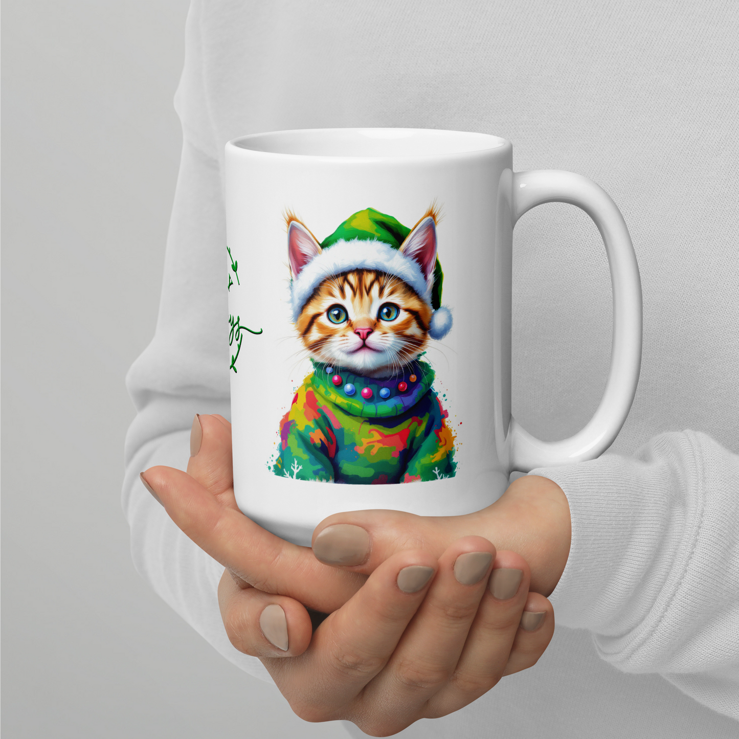 Kitten Wearing Colorful Sweater and Green Santa Hat White Glossy Mug