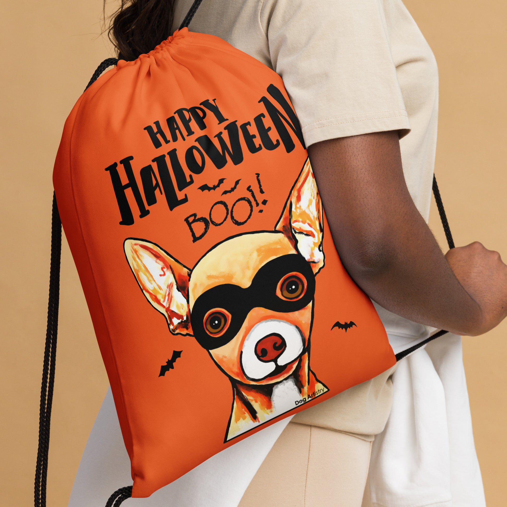 Happy Halloween Chihuahua wearing mask Orange drawstring bag by Dog Artistry Halloween candy bag. Close up.