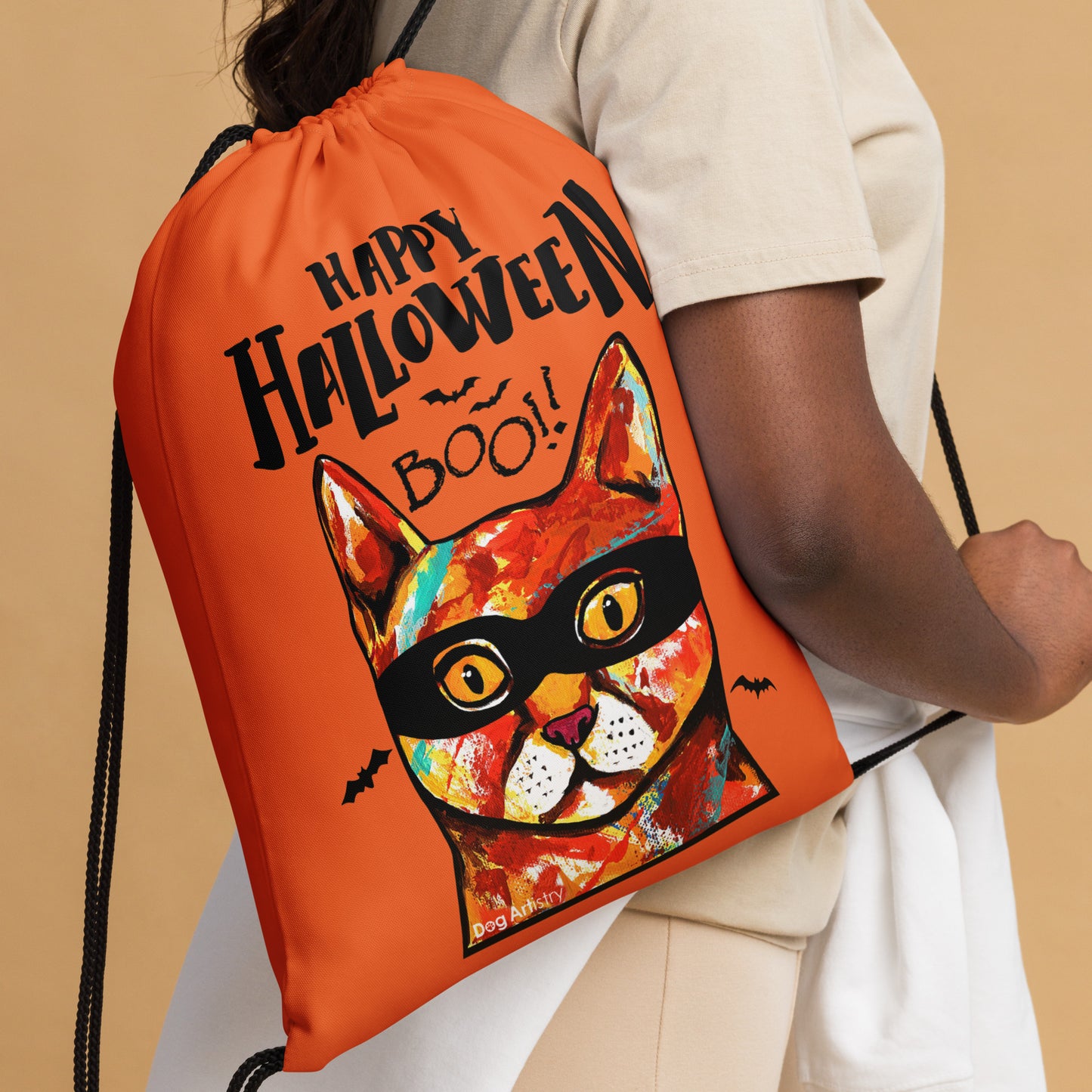 Happy Halloween Cat wearing mask Orange drawstring bag by Dog Artistry Halloween candy bag. Close up.