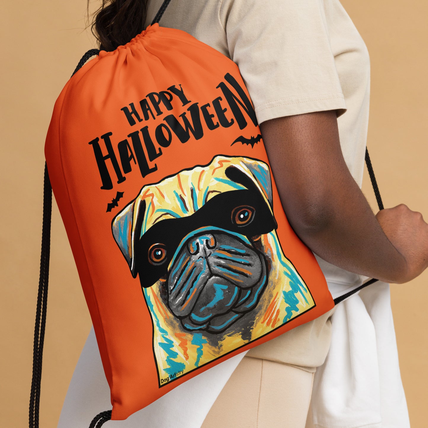 Happy Halloween Pug wearing mask Orange drawstring bag by Dog Artistry Halloween candy bag. Close up.