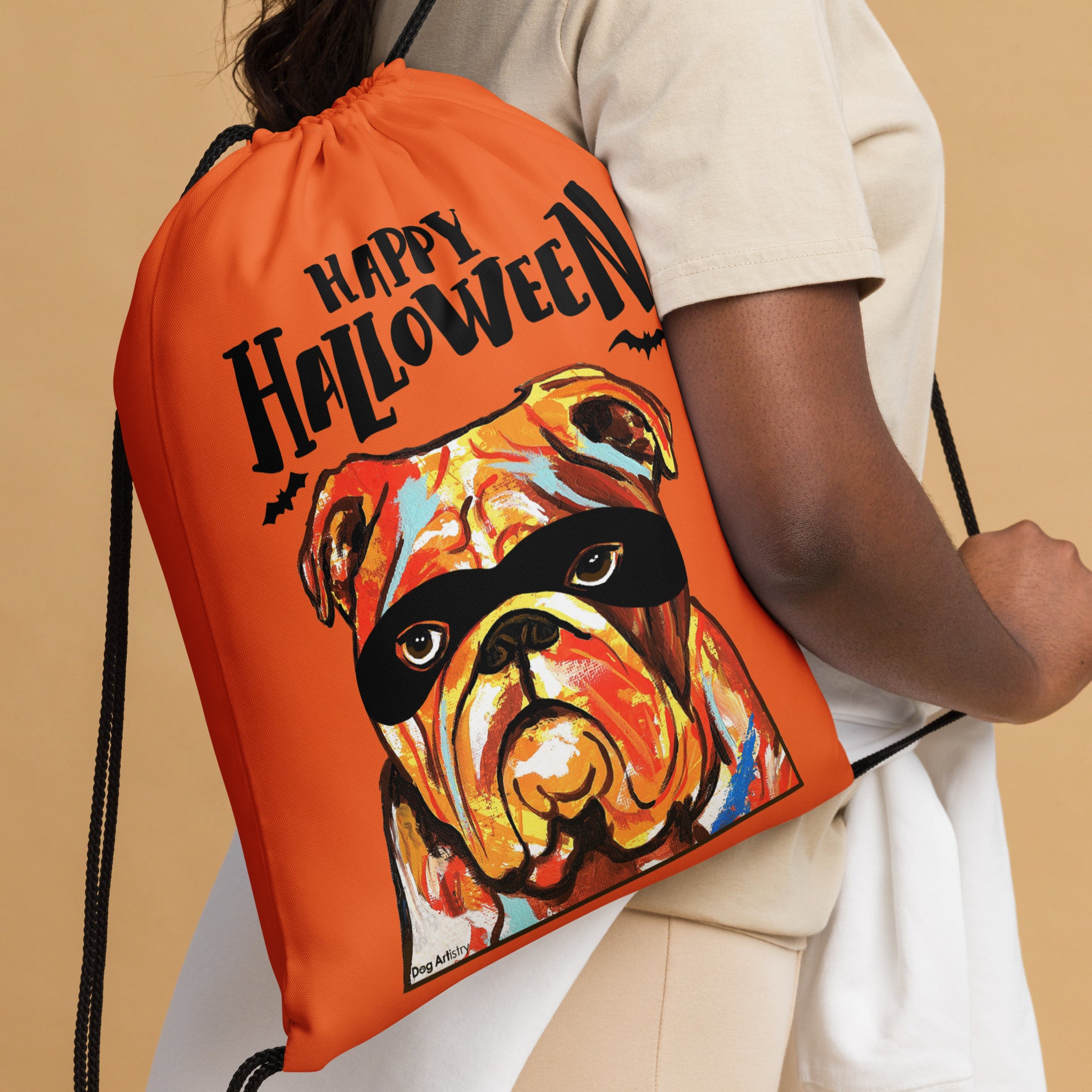 Happy Halloween English Bulldog wearing mask Orange drawstring bag by Dog Artistry Halloween candy bag. Closeup.